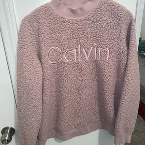 Pink Calvin Klein sweater embodied